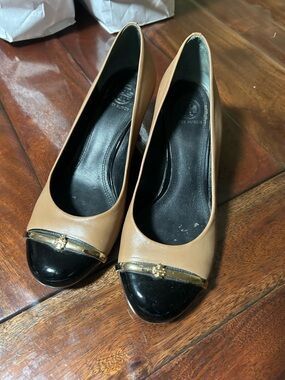 Tory Burch Two-Tone Cap Toe Pumps in Camel and Black with Gold Trim